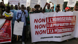 FILE PHOTO: Anti-LGBT demonstrators march through the streets during a protest calling for tougher action in Dakar