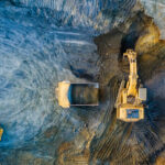 Quarry,Mining,,Work,Of,The,Excavator,And,Dump,Trucks,,Photo